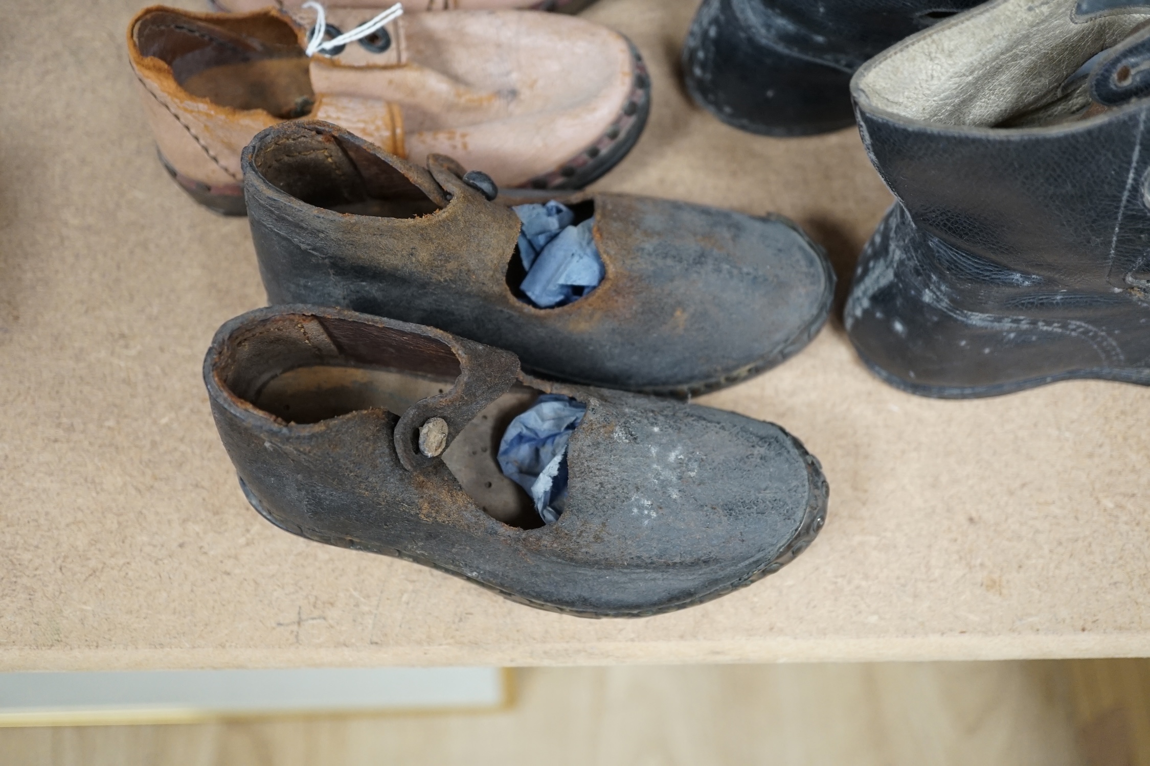 Three pairs of late 19th / early 20th century children’s boots and clogs, largest 14cm in length. Condition - poor to fair